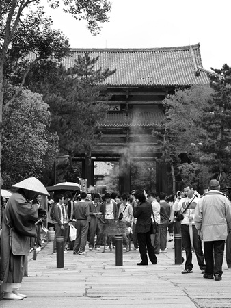Monk and tourists visiting Todai-ji